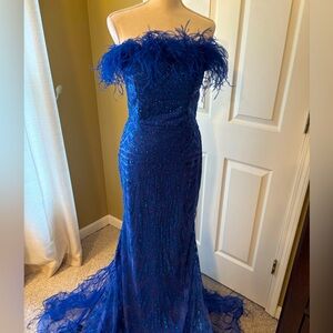 Blue strapless feather accent evening gown